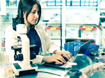 lab_woman_microscope_laptop